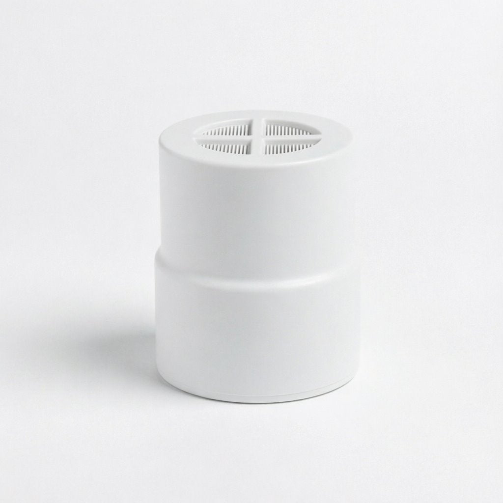 A white cylindrical filter with a slotted top opening, shown on a seamless white background.